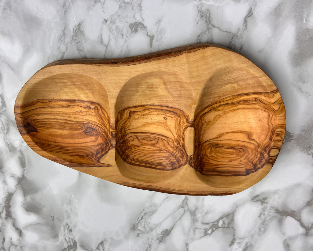 Multi-section olive wood snack bowl, ideal for nuts, olives, dips, and appetizers. Features a rustic design